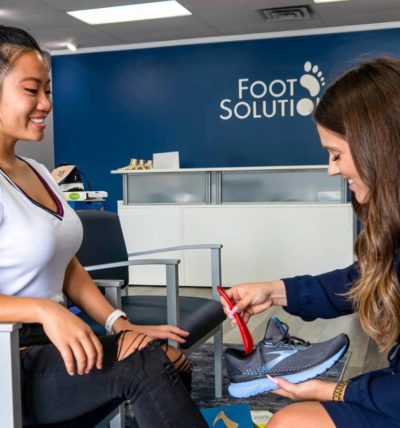 Image of Woman getting shoes fitted